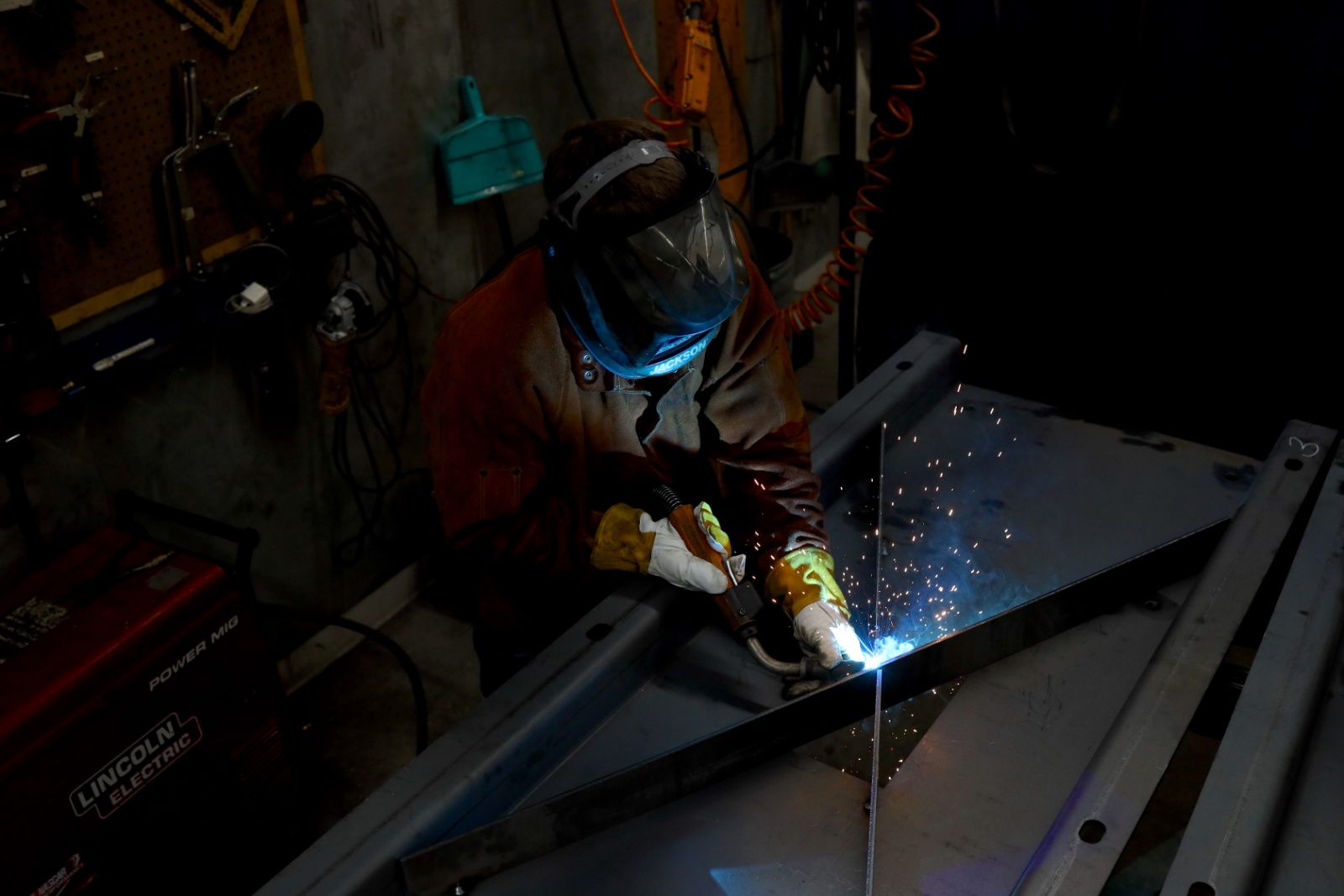 employee welding at IGH Steel
